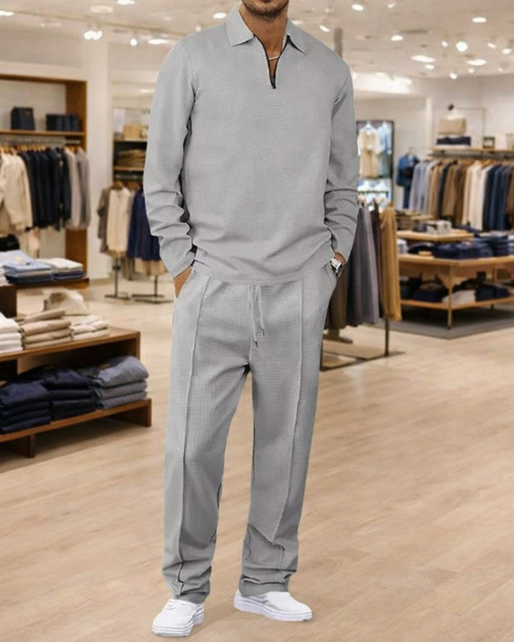 Conjunto de hombre compuesto por sudadera de punto gofre y pantalón recto.
