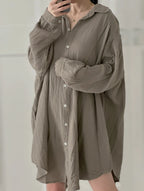Blusa de muselina, larga, oversize, gris pardo.